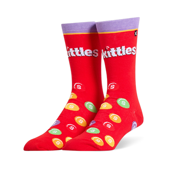 Bright red crew socks featuring a purple cuff, the white Skittles logo, and scattered colorful candy pieces with white S marks.