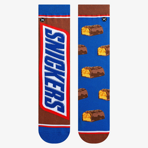 Flat lay showcasing a pair of Snickers Split socks, highlighting the detailed Snickers bar and candy piece designs.
