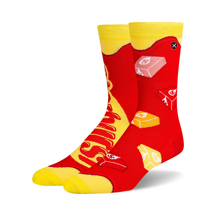 Pair of crew socks in red and yellow, featuring a Starburst candy design.  The socks show the candy's logo and individual candies.