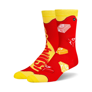 Pair of crew socks in red and yellow, featuring a Starburst candy design.  The socks show the candy's logo and individual candies.