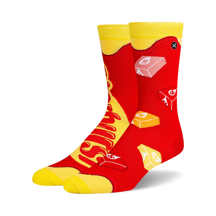Pair of crew socks in red and yellow, featuring a Starburst candy design.  The socks show the candy's logo and individual candies.