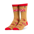 Tan crew socks featuring a large red Twix logo, red cuffs and toes, and a pattern of wrapped and broken candy bars.