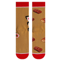 Close-up shot highlighting the fabric texture and detailed Twix bar illustrations on the socks.