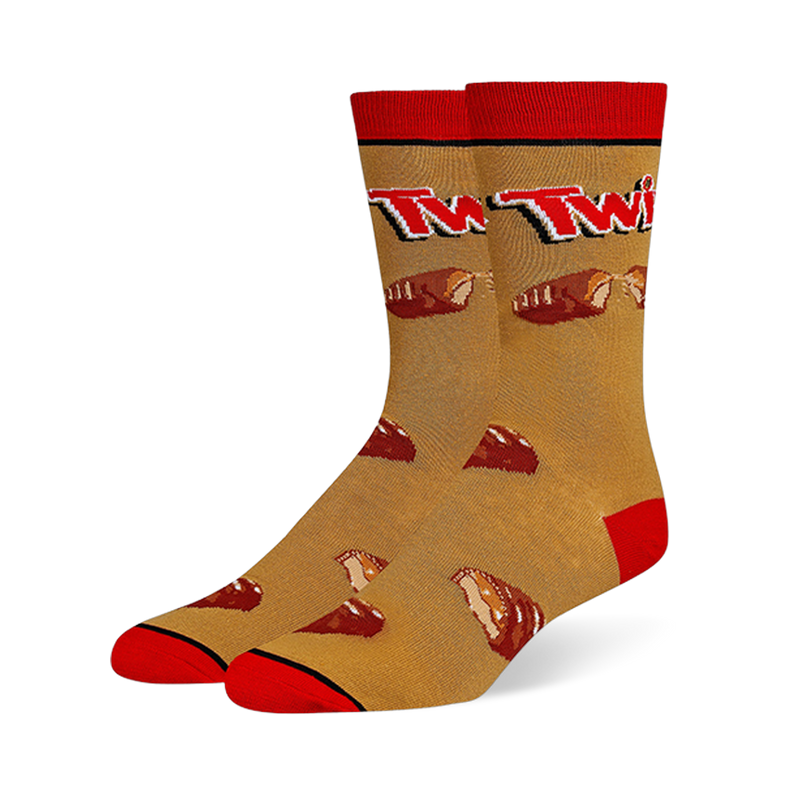 Crew socks with a golden caramel background, red cuffs, heels and toes, featuring the Twix logo and broken chocolate bars.