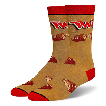 Crew socks with a golden caramel background, red cuffs, heels and toes, featuring the Twix logo and broken chocolate bars.