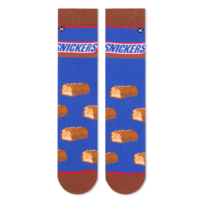 Flat lay of two blue crew socks side-by-side, displaying the Snickers logo at the top and mini chocolate bars below.