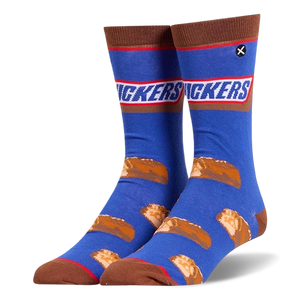 Blue crew socks featuring the Snickers logo at the calf, brown accents, and a pattern of sliced mini chocolate candy bars.
