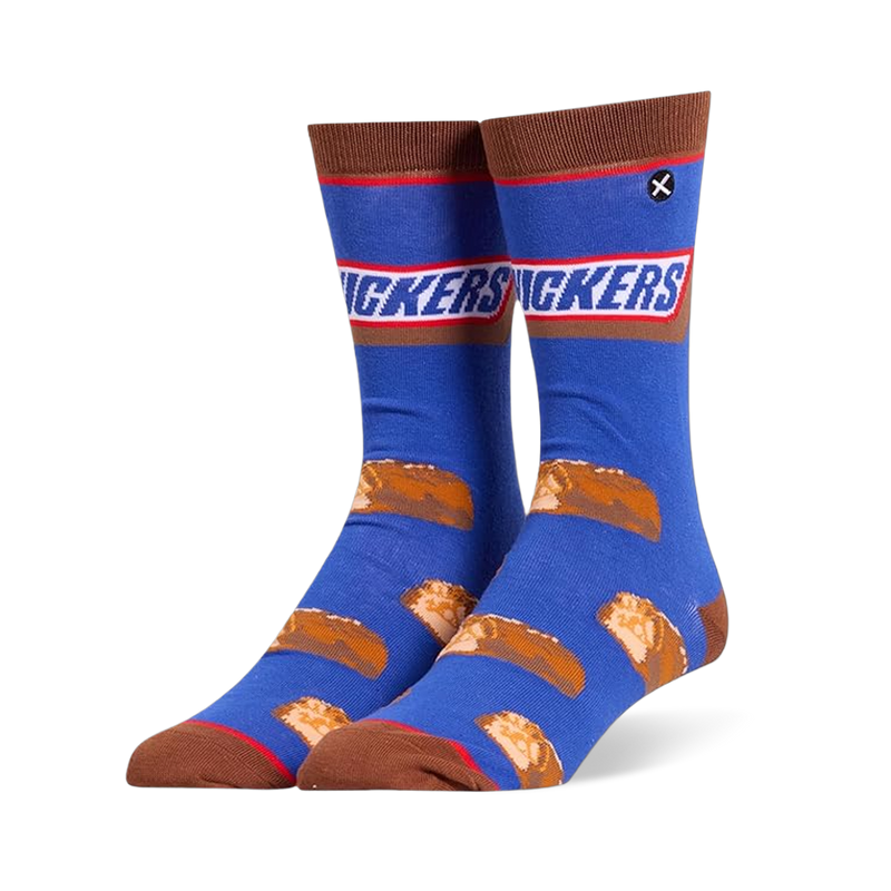 Blue crew socks featuring the Snickers logo at the calf, brown accents, and a pattern of sliced mini chocolate candy bars.
