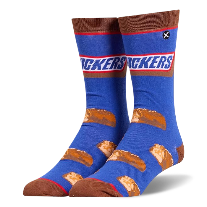 Blue crew socks featuring the Snickers logo at the calf, brown accents, and a pattern of sliced mini chocolate candy bars.
