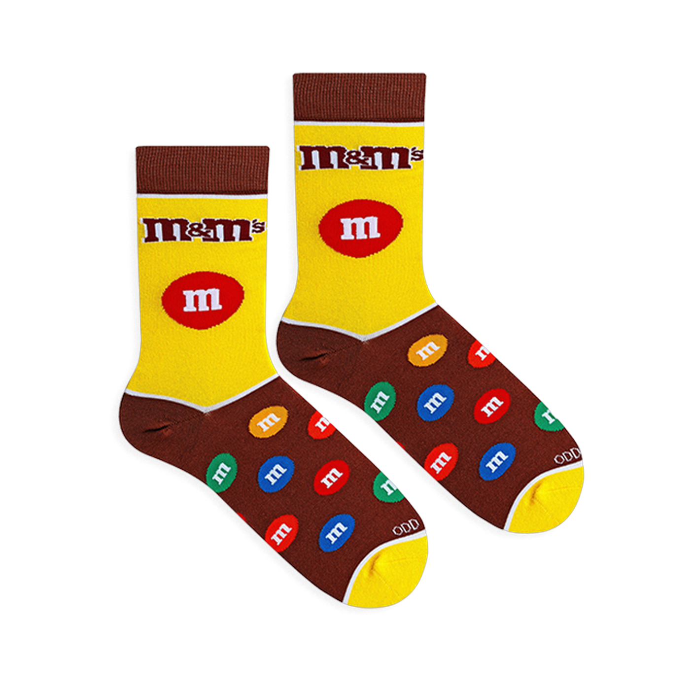 Flat lay of yellow and brown M&M's socks showing the classic logo, a large red candy on the leg, and a colorful candy foot.