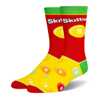 Novelty socks with a red top, green cuff, and yellow foot. Features the Skittles logo and a scattered colorful candy pattern.