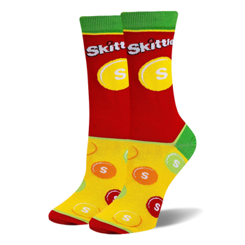 Crew socks with a red upper featuring the Skittles logo, green cuffs and heels, and a yellow foot with scattered candy pieces.