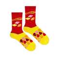 Flat lay of two Starburst socks showing the red upper with retro logo and candies, and a yellow foot with colorful drops.