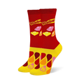 Red crew socks with the Starburst logo and wrapped candies, featuring a yellow foot covered in colorful droplet shapes.