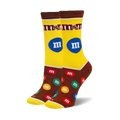 Pair of crew socks with an M&M's design.  Yellow and brown background with colorful M&M candies and the M&M's logo.