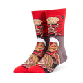 Red and grey crew socks displaying stacked Attack on Titan faces, featuring the Colossal, Armored, and Female Titans.