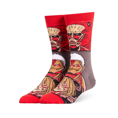Red and grey crew socks displaying stacked Attack on Titan faces, featuring the Colossal, Armored, and Female Titans.