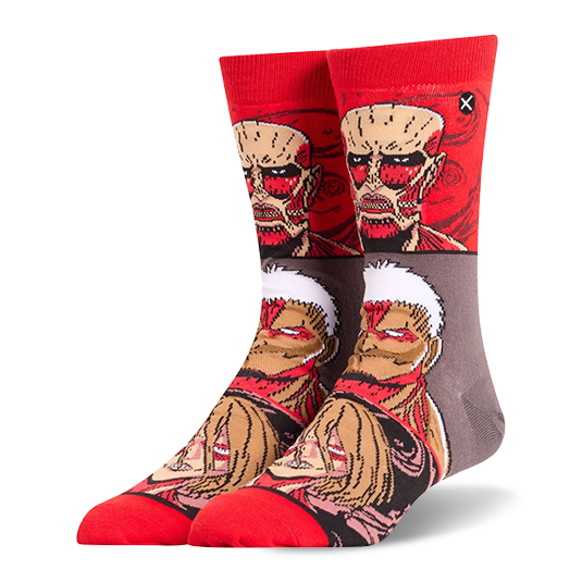 Red and grey crew socks displaying stacked Attack on Titan faces, featuring the Colossal, Armored, and Female Titans.