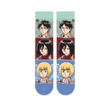 Flat lay of two crew socks side by side showing horizontal color blocks featuring determined anime character faces.