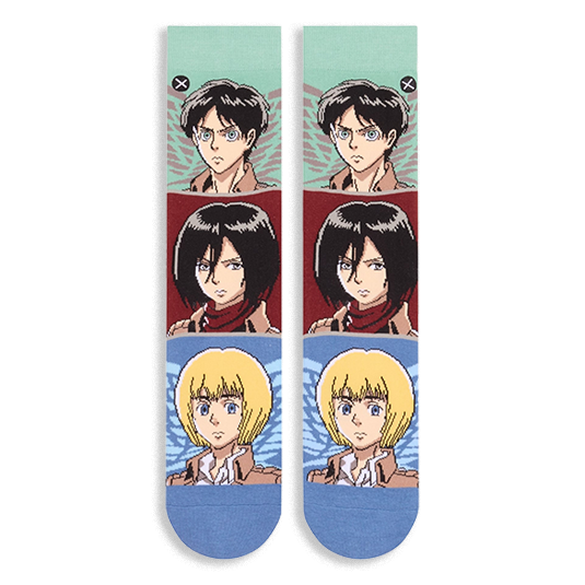 Flat lay of two crew socks side by side showing horizontal color blocks featuring determined anime character faces.