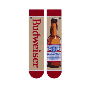 Flat lay of mismatched tan socks. One features vertical red Budweiser text, the other a full brown beer bottle illustration.