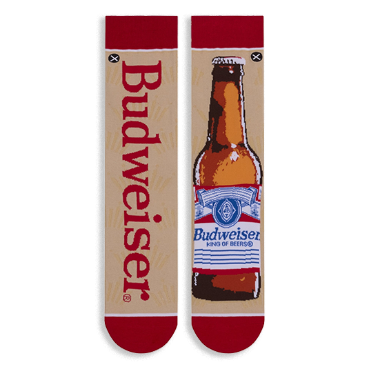 Flat lay of mismatched tan socks. One features vertical red Budweiser text, the other a full brown beer bottle illustration.