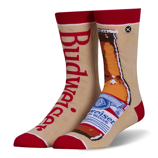 Mismatched tan crew socks with red accents. Left sock has red Budweiser text, right sock shows a brown beer bottle.