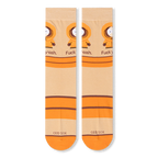 Flat lay front view of beige crew socks showing the repeated Kenny graphic, bold text, orange stripes, and orange toes.