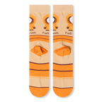 Flat lay back view of beige socks displaying the wrapped orange stripes, orange heel block, and small brown copyright text.