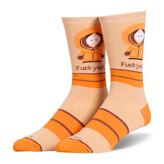 Light beige crew socks featuring Kenny in his orange parka above the text 'Fuck yeah.', accented with bold orange stripes.