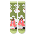 Flat lay of two olive green socks showing a person in a pink blanket, black cat, clouds, and bold white text.