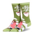 Olive green crew socks showing a person in a pink blanket, a black cat, coffee cups, and Go Away I'm Introverting text.