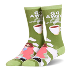 Olive green crew socks showing a person in a pink blanket, a black cat, coffee cups, and Go Away I'm Introverting text.