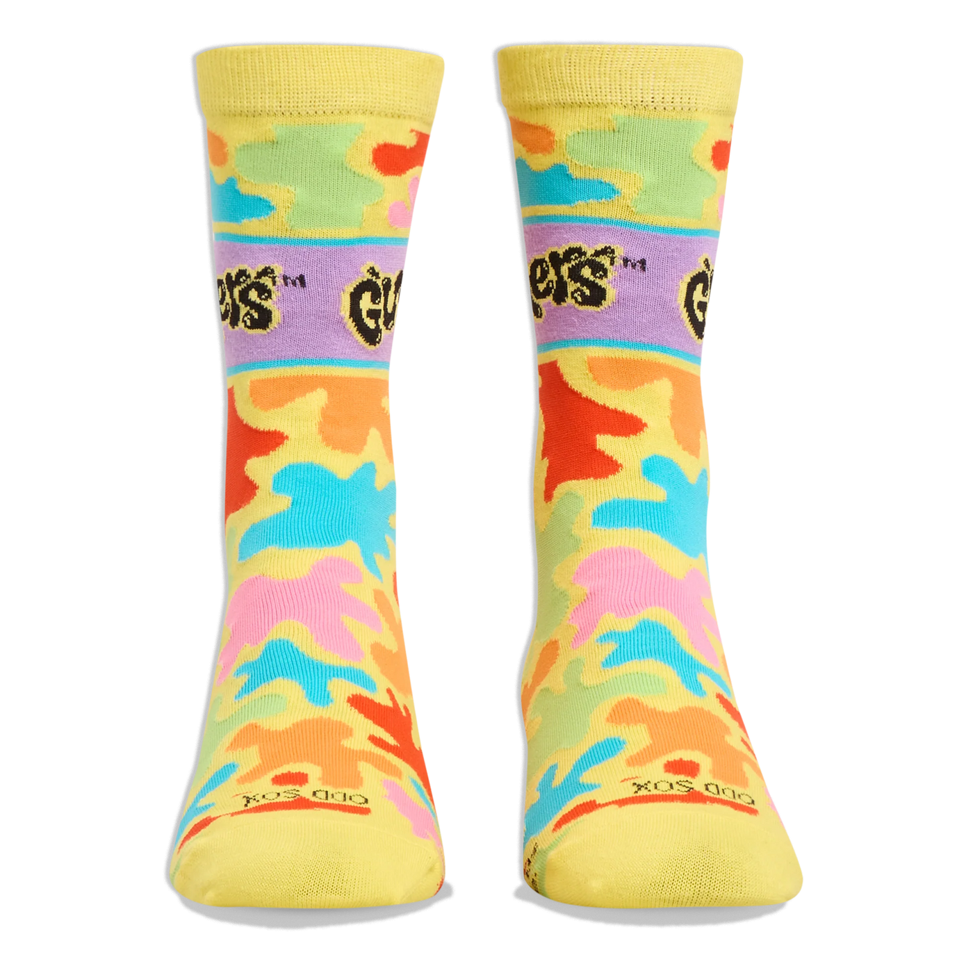 Front view of yellow crew socks showing the purple Gushers logo band on the shins and colorful neon splatters throughout.