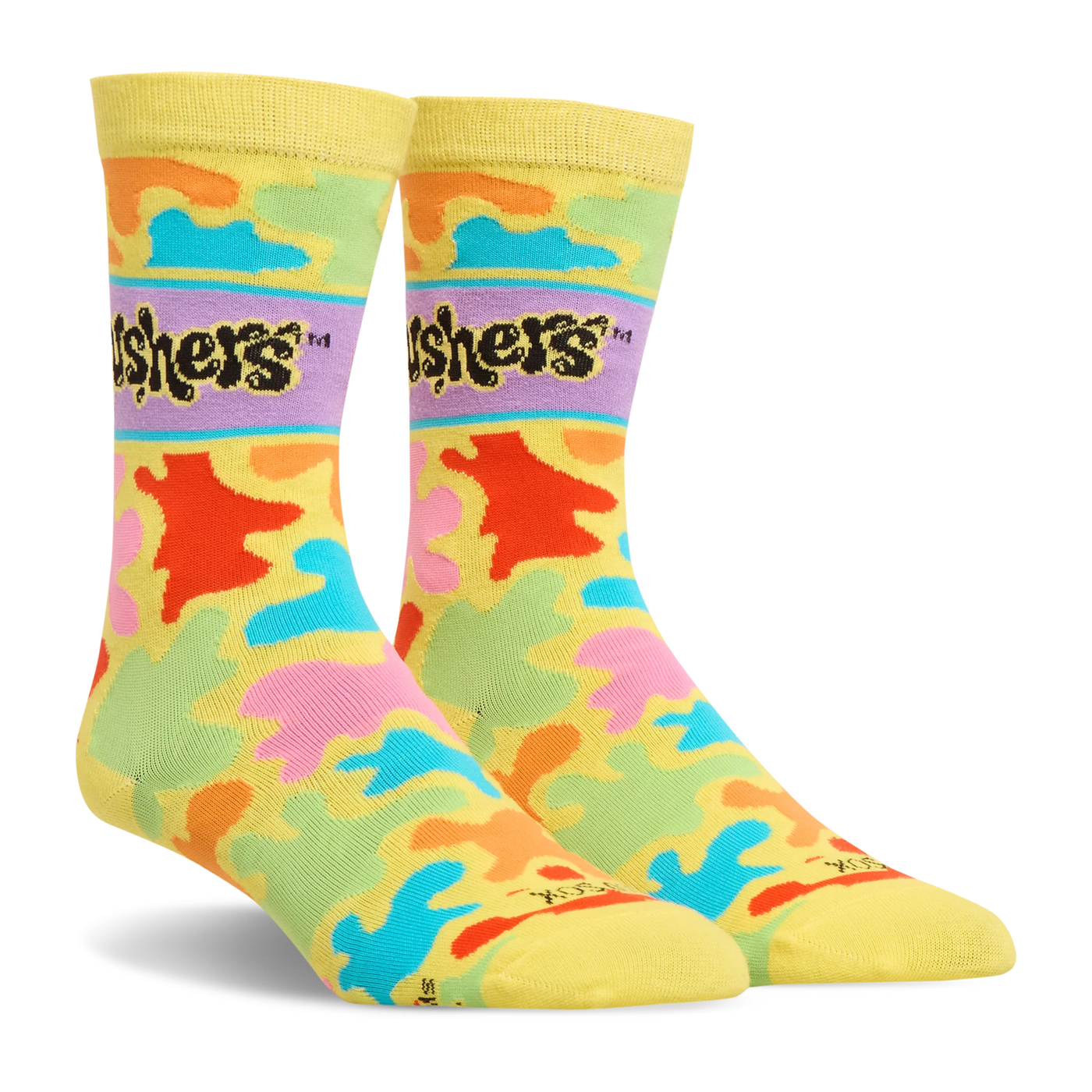 Side angle view of yellow crew socks with a colorful splash pattern in bright neon colors and the black Gushers logo.