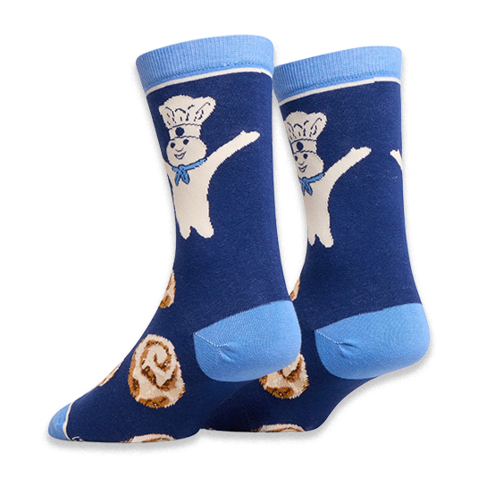 Angled view of dark blue socks highlighting the light blue heel and back of the Pillsbury Doughboy and cinnamon roll design.