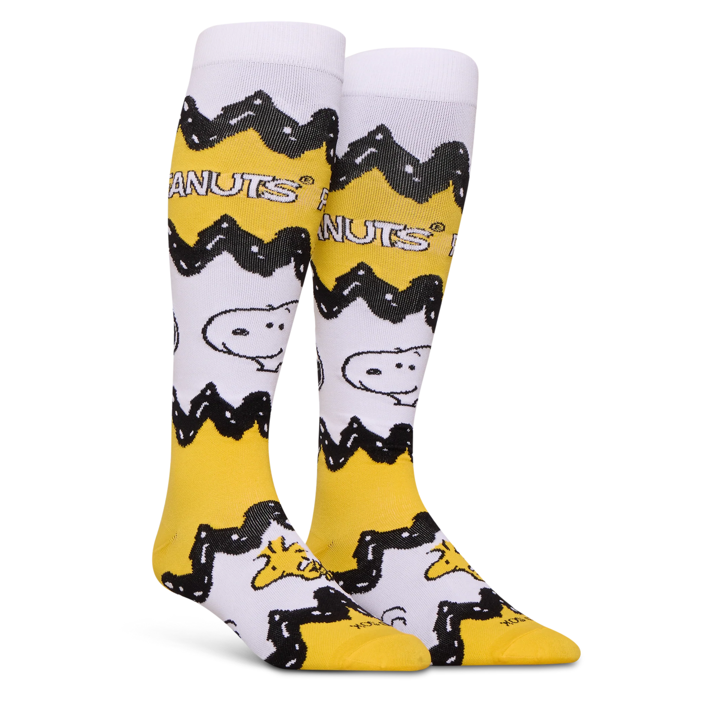 Left angled view of Peanuts socks displaying the wrapping yellow and black zigzag pattern with Snoopy on a white background.