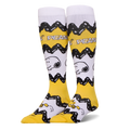 Tall yellow and white Peanuts socks featuring Charlie Brown's black zigzag pattern, Snoopy's face, and Woodstock at the toe.