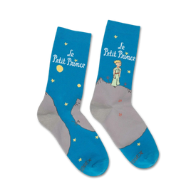 blue crew socks feature the little prince standing on a mountain range under a starry night sky.   