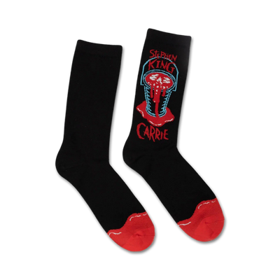 Pair of black crew socks.  Feature a red and teal graphic of a bloody bucket from Stephen King's Carrie, with the title below.