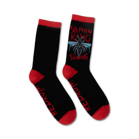 men's and women's stephen king crew socks: black with red cuff and â€œredrum" pattern. shining and stephen king written in red and blue on each sock. bee and wasp icons.  
