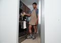 Standing at a stainless oven, an apron-clad home chef pours dry pasta from a paper box into a pot, his Hasta La Pasta socks in Navy planted on the kitchen tile. [lf]