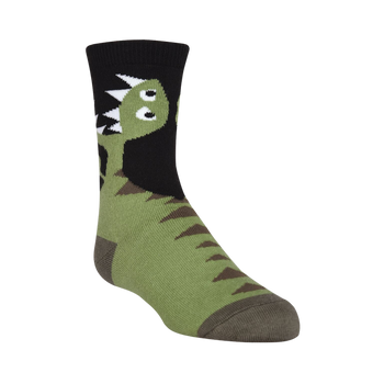 green, brown, and black cotton crew socks with a pattern of brown t-rex dinosaurs with white details.   