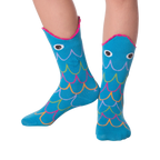 Lifestyle photo showing Fish Wide Mouth socks on a person's legs against a black background.