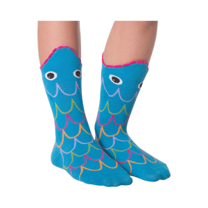 Another lifestyle shot of the Fish Wide Mouth socks on legs against a black background; different pose.