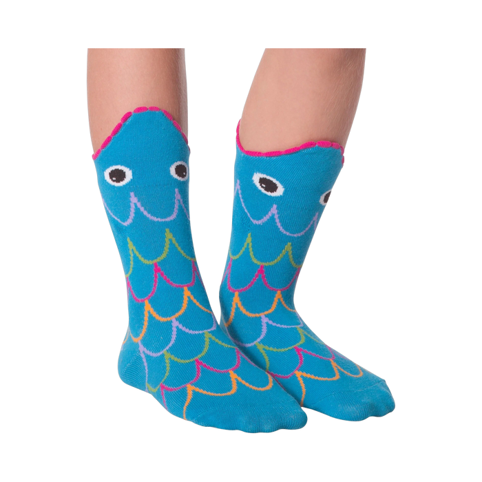 Another lifestyle shot of the Fish Wide Mouth socks on legs against a black background; different pose.
