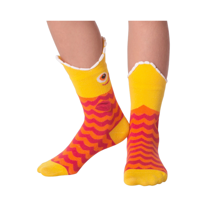 Lifestyle shot of Piranha Wide Mouth socks on a person's legs against a black background.