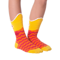 Another lifestyle shot of Piranha Wide Mouth socks on a person's legs against a black background, slightly different angle.