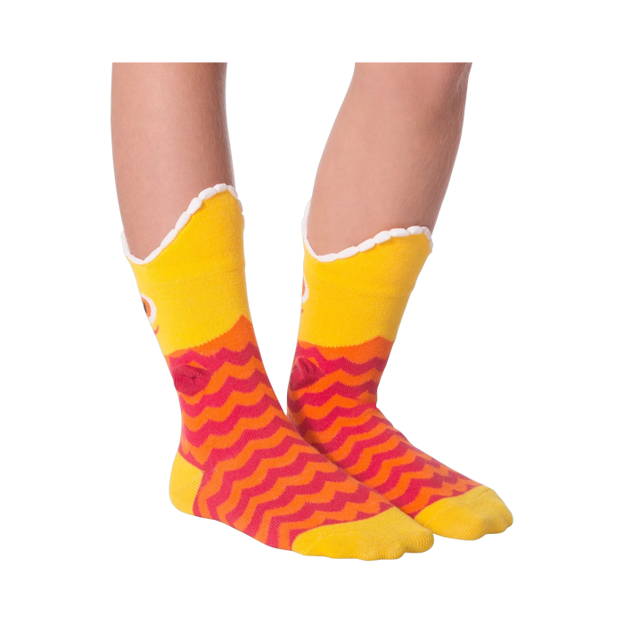 Another lifestyle shot of Piranha Wide Mouth socks on a person's legs against a black background, slightly different angle.
