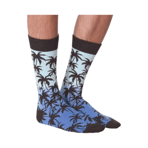 Front view of Palm Socks on a person's legs against a black background.